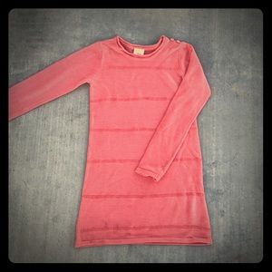 Girl's peach knit dress with sequins.
